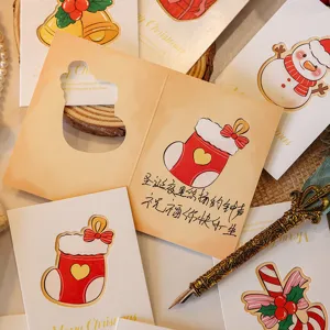 Detailed view of hollow Christmas greeting cards with festive stocking and snowman