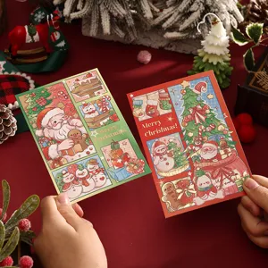 Close-up of festive Christmas cards with gold foil stamping and cute cartoon illustrations.