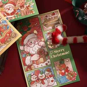 Detailed view of festive Christmas cards featuring gold foil Santa and snowman illustrations.