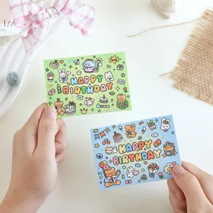 Detail shot of adorable cartoon birthday message cards with hand-drawn animal patterns