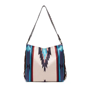 Detail of ethnic pattern retro cotton linen shoulder bag with side tassels