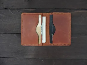Close-up detail of vintage crazy horse leather card holder with dual inner card slots