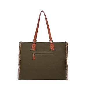 Front view of olive green canvas tote bag with brown leather handles and fringe trim