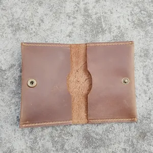 Detailed interior view of a vintage brown crazy horse leather card holder with dual slots