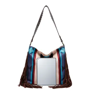 Woven tassel hobo bag with colorful patterns shown with tablet for size comparison