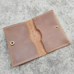 Detailed interior view of a vintage brown crazy horse leather card holder wallet.
