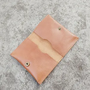 Detailed view of the interior slots of a vintage brown crazy horse leather card holder