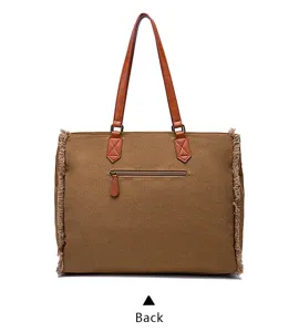 Back view of a retro Bohemian brown canvas tote bag with fringe details and leather straps