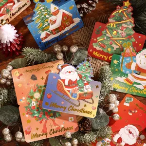 Detailansicht festlicher Weihnachtsgrußkarten mit Goldfolienprägung und süßen Illustrationen.