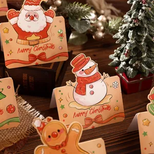 Detail view of vintage cartoon Christmas greeting cards featuring Santa Claus and a snowman