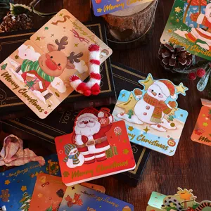 Detailansicht von festlichen Weihnachts-Grußkarten mit einer edlen goldenen Merry Christmas Prägung