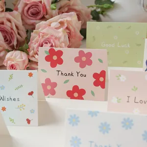 Macro detail of minimalist floral greeting cards with Thank You and Good Luck text