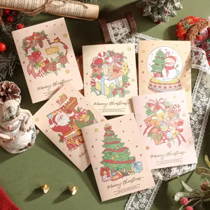 Vue détaillée de cartes de Noël à l'aquarelle avec dorure et illustrations festives