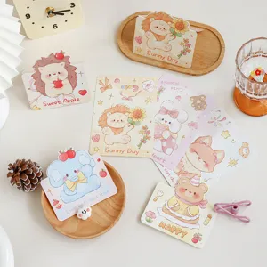 Close-up detail of adorable cartoon animal mini greeting cards with sweet English text