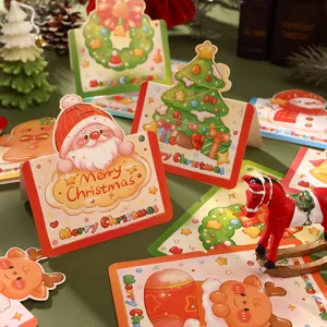 Detailed view of various colorful 3D cartoon Christmas greeting cards and festive tags