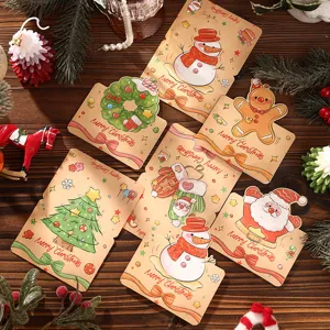 Detailed view of various retro cartoon Christmas greeting cards on a wooden surface