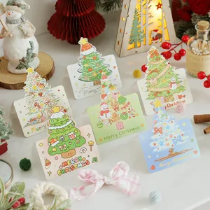 Variety of cute cartoon Christmas greeting cards with festive tree illustrations