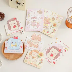 Detailed macro view showing a collection of cute cartoon animal greeting cards.