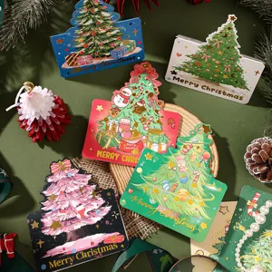 Detailed view of colorful Christmas tree greeting cards with gold foil Merry Christmas text