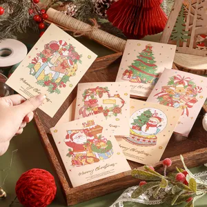 Vue détaillée de cartes de Noël à l'aquarelle avec dorure et décorations festives