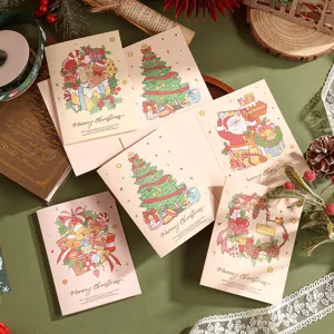 Détail de cartes de Noël à l'aquarelle avec lettrage élégant en feuille d'or