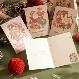 Vue détaillée de cartes de Noël à l'aquarelle avec dorure à l'or élégante.
