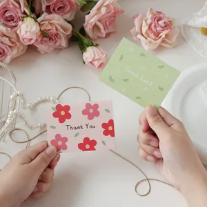 Detail view of floral message cards featuring Thank You and Good Luck printed text