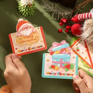 Detailed view of cute cartoon Santa and gift box Christmas cards for holiday greetings