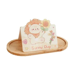 Adorable cartoon lion greeting card with sunflower pattern and Sunny Day message for kids.