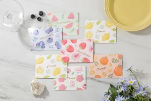 Detailed view of various cute fruit-themed greeting cards with gold foil stamping
