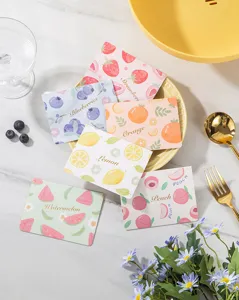 Set of six cute fruit greeting cards with elegant gold foil lettering on a marble table