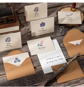 Vintage kraft paper greeting cards with envelopes for various occasions shown on desk