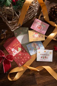 Festive trifold Christmas greeting cards with cute cartoon illustrations and envelopes.