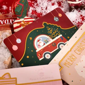 Close-up of creative Christmas cards with gold foil stamping and festive illustrations
