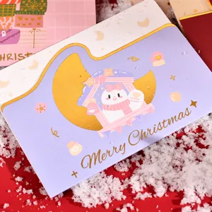 Close-up of a purple Christmas card with gold foil Merry Christmas text and snowman