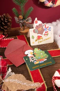 Detail view of festive Christmas gift cards featuring gingerbread man and puppy tree