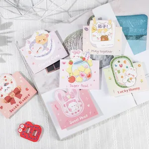 Collection de jolies cartes de vœux avec des lapins et des ours sur un magazine