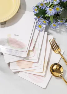 Close-up of stacked cute fruit-themed gift cards with elegant gold-stamped details.