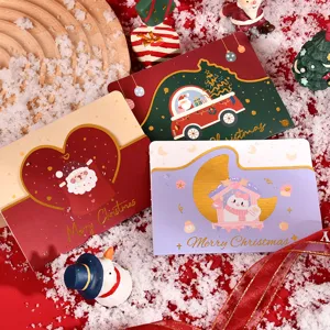 Detailed view of gold-foil die-cut Christmas greeting cards with cute festive designs