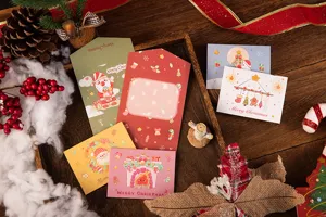 Detailed view of colorful cartoon tri-fold Christmas greeting cards with festive decorations