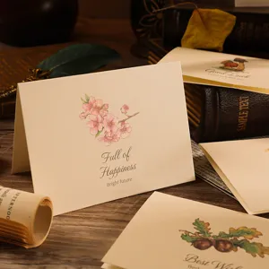 Close-up of vintage floral folded greeting cards featuring Full of Happiness text design.