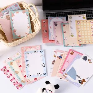 Close-up of cute animal-themed greeting cards and packaging labels in soft colors
