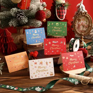 Close-up of six colorful gold-stamped Christmas greeting cards with festive decor
