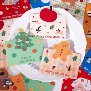 Detailed view of assorted retro cartoon Christmas gift cards with cute holiday illustrations