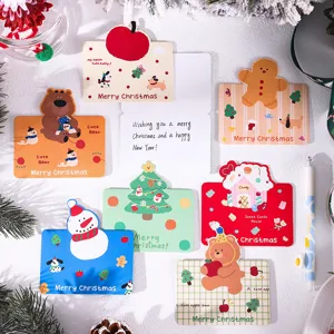 Close-up of diverse cartoon Christmas greeting cards with festive message space