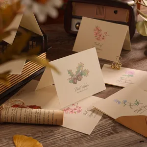 Close-up of vintage floral greeting cards with hand-drawn botanical illustrations
