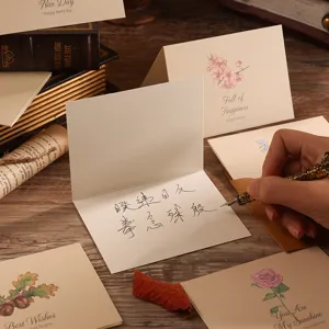 Vintage Chinese style floral greeting card being handwritten with a fountain pen