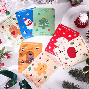 Detail view of colorful Christmas greeting cards with festive cartoon illustrations