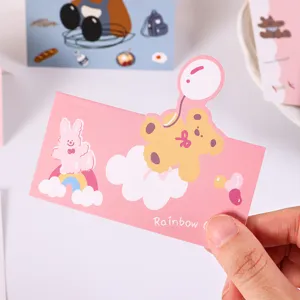 Close-up of cute pink card header with cartoon bear and rabbit design for gift packaging.