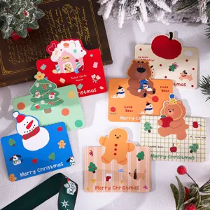 Detailed view of assorted cute Christmas greeting cards with festive illustrations